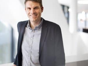 Portrait Bild von Marc-Olivier Weber mit dunklen Haaren, im Anzug