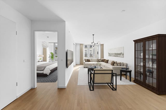 Computeranimation einer möglichen Apartmenteinrichtung in der Tertianum Residenz Berlin. Zu sehen ist der Wohn- und der Schlafbereich einer Wohnung mit Wintergarten.